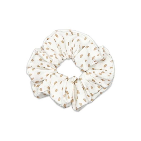 An Emery - Bamboo scrunchie with gold polka dots from Tiny Knot Co.