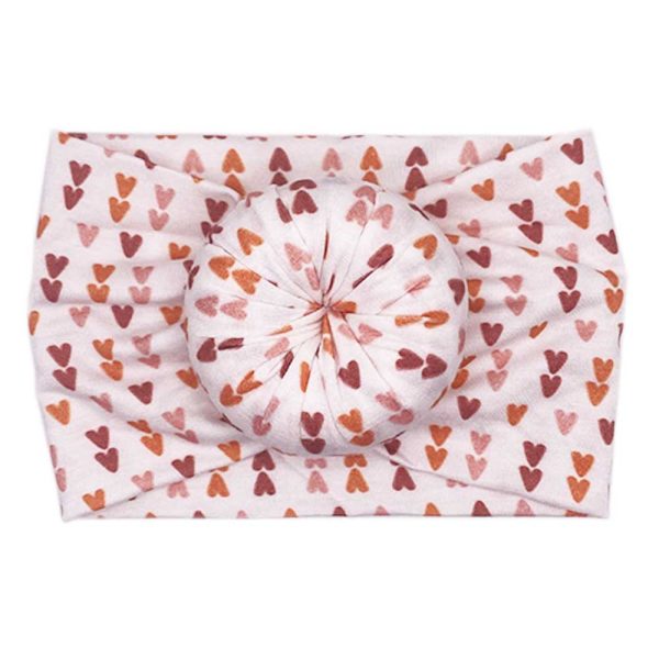 A bamboo baby headwrap with hearts on it, from Tiny Knot Co.