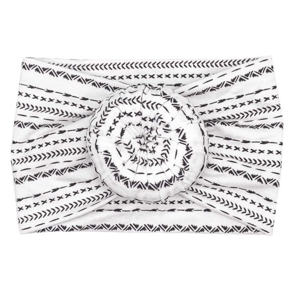 A Lennox - Bamboo Baby Knotted Headwrap with black and white designs from Tiny Knot Co.