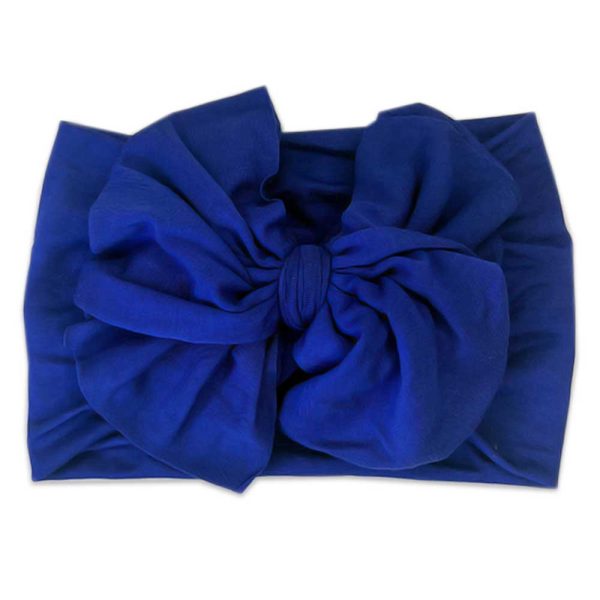 Tiny Knot Co's blue headband with a bow.