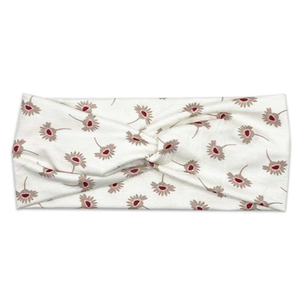 A white Poppy - Women's Bamboo Headwrap adorned with red flowers from Tiny Knot Co.